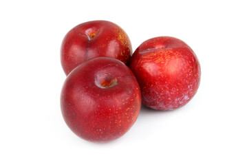 Fototapeta na wymiar Three red plums isolated on white background