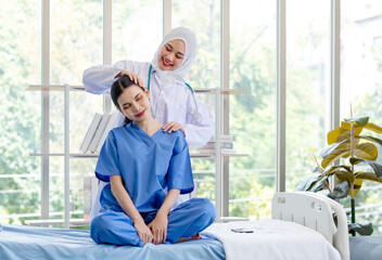 Asian professional successful experienced muslim female doctor in white lab coat with hijab...