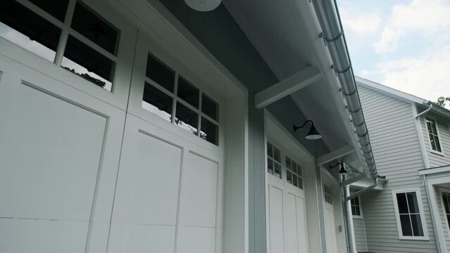 Establishing shot of Garage door in luxury house with part of big 