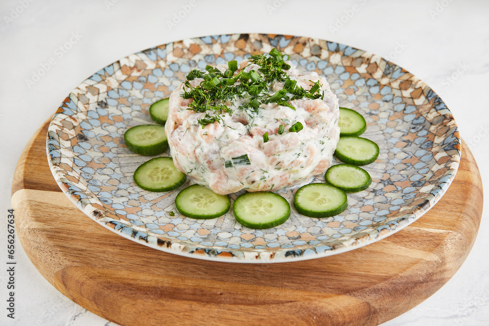 Sticker Salmon tartare with cheese, zucchini and herbs