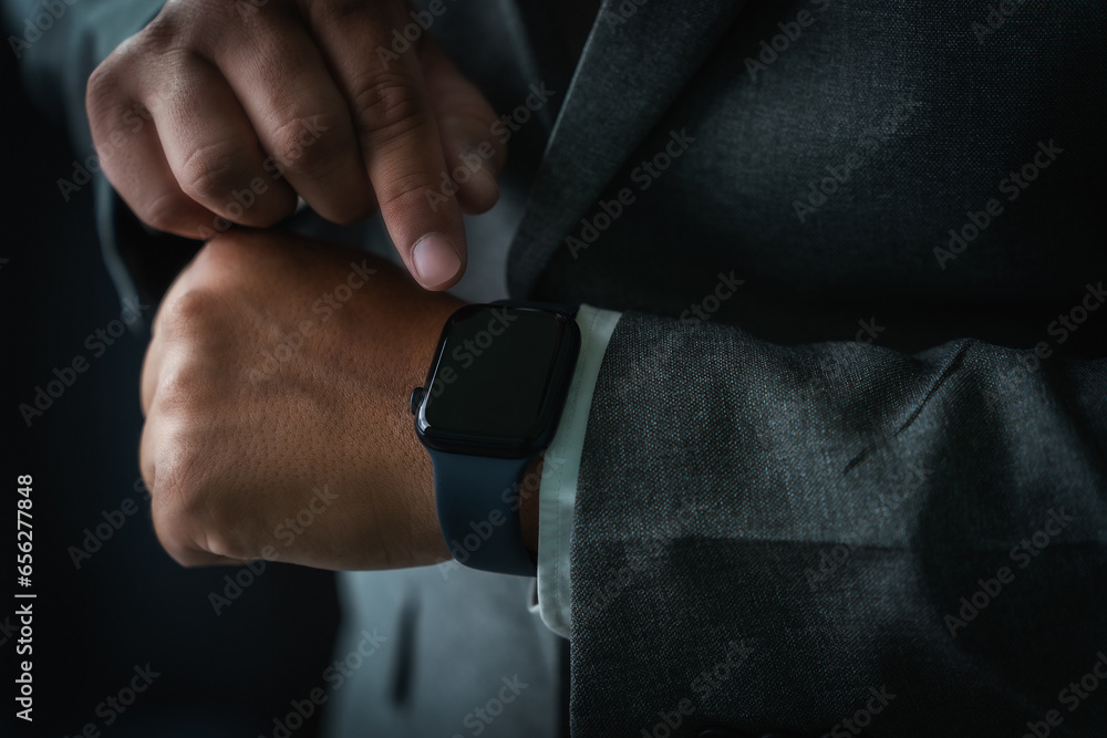 Poster man checking time on his smartwatch device close-up display clock checking lifestyle communication p