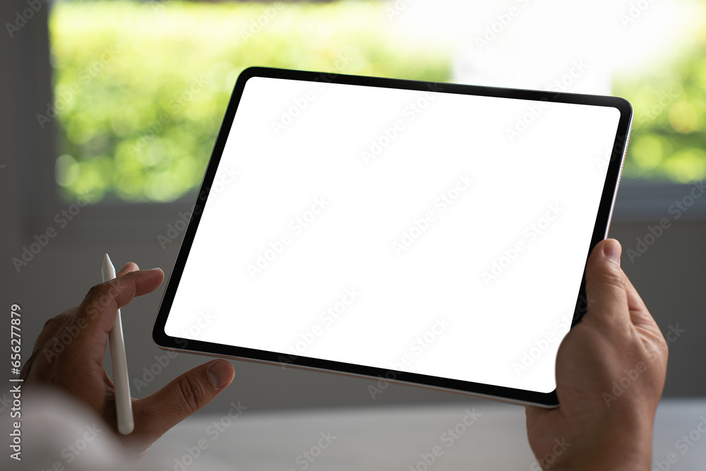 Poster digital tablet computer close up man using tablet hands man multitasking with isolated screen