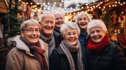 A Happy diverse group of senior friends outside their decorated house for the Christmas and new year holidays