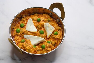 Famous Indian curry dish Paneer matar masala. vegetarian North Indian dish consisting of peas and paneer in a tomato based sauce, spiced with indian spices and garam masala. peas and cottage cheese. 