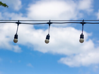 hanging bulbs on blue sky