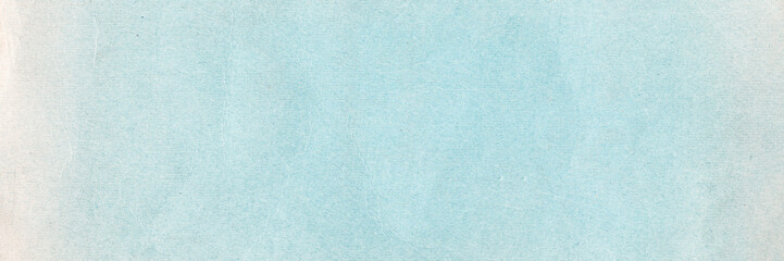 Old blue paper texture. Rough faded surface. Blank retro page. Empty place for text. Perfect for background and vintage style design. Wide panoramic light background texture.