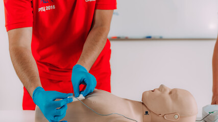 AED first aid resuscitation course. Life saving skills in a first aid resuscitation course using an AED