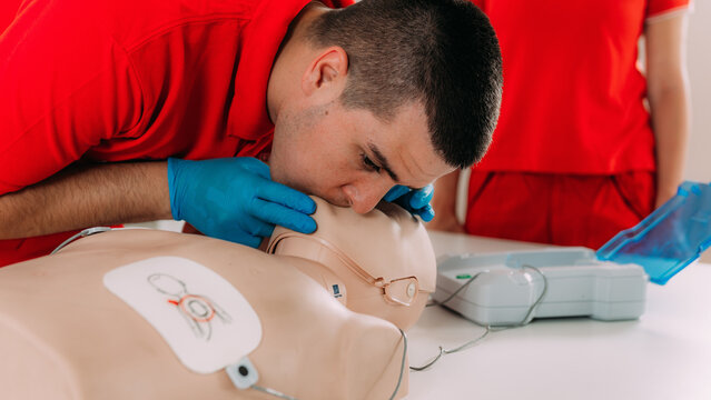 AED first aid resuscitation course. Life saving skills in a first aid resuscitation course using an AED