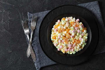 Ambrosia Salad in black bowl, top view