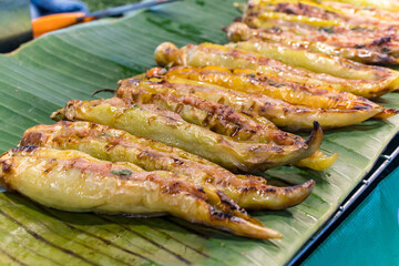 Thai food, roasted green peppers in market