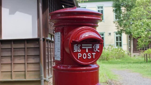 Japanese old-style red letterbox in rural area