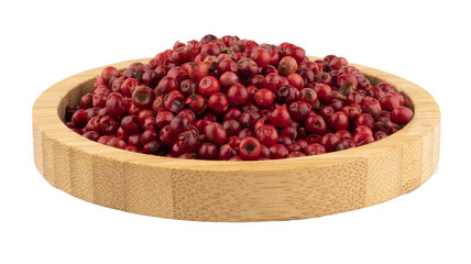 red black pepper balls in a wooden bowl