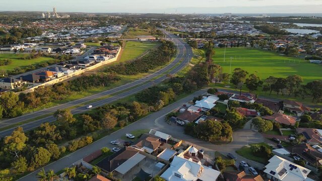 Aerial View of Car Traveling on Curvy Empty Highway in Residential Suburb in Perth, Western Australia 