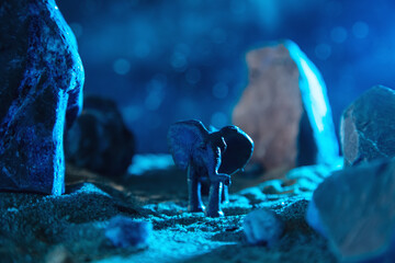 Elephant in a rocky gorge at night.
