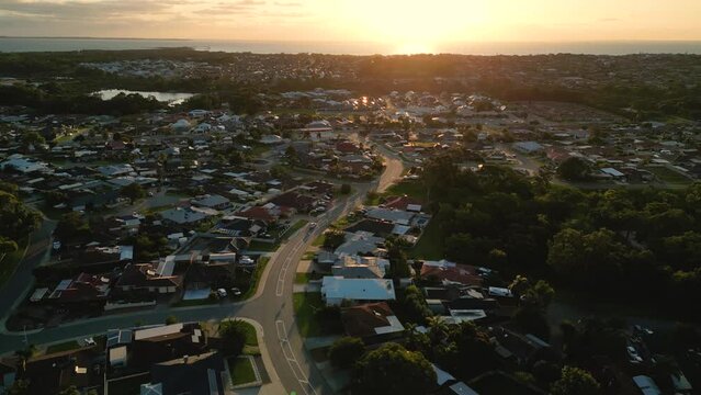 Aerial View of Perth Coastal Suburn Neighborhood With Private Houses During Sunset Over Indian Ocean - copy space