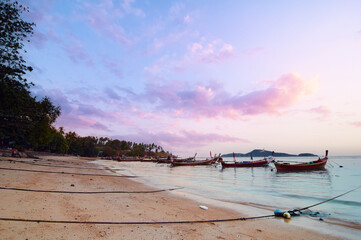 Beautiful landscape with traditional longtail boat on the beach. Phuket, Thailand.