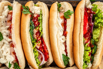 Hot dogs with different toppings. Food recipe background. Close up