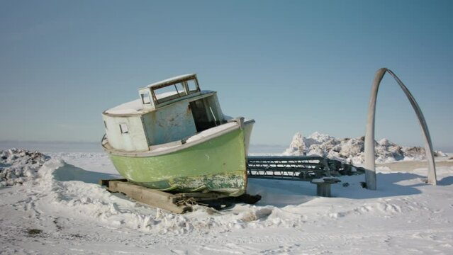 Winterized boat on snowy beach at Utqiagvik Barrow Alaska North Slope in the Arctic