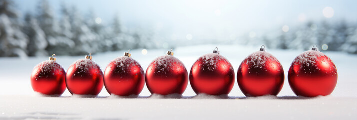 Row of red shiny christmas balls on the snow