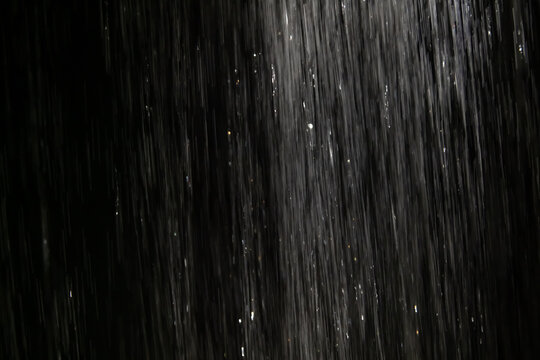 Rain texture overlay effect on black background, realistic rainfall