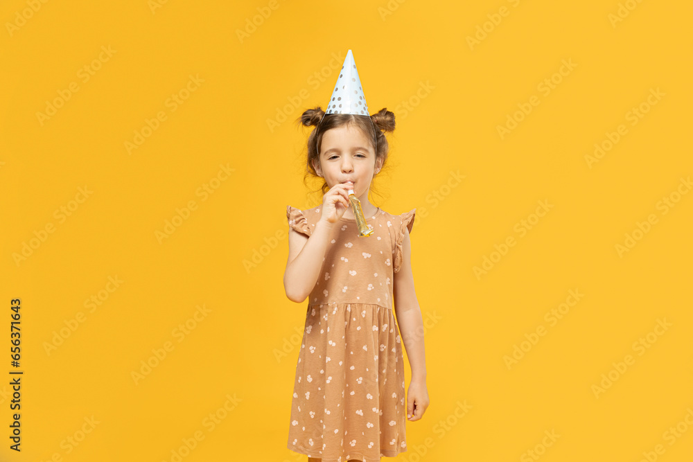 Poster A little girl in a holiday cap with a pipe