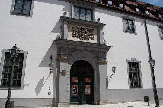 Augsburg, Germany - July 2, 2021: The Augsburger Puppenkiste ("Augsburg Puppet Box"), a famous marionette theater, which is housed in a building of the Heilig-Geist-Spital, a former hospital.