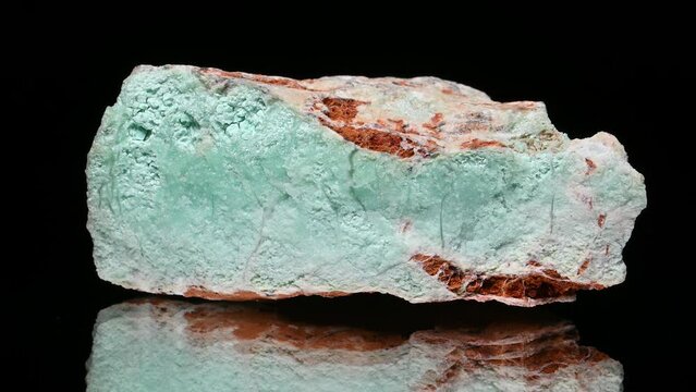 Chrysoprase (gemstone variety of Chalcedony) specimen rotating slowly against a black background.