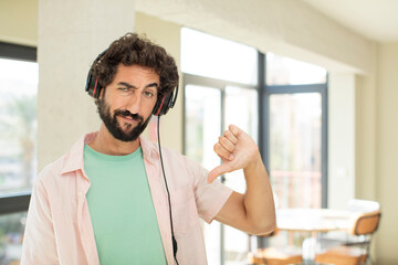 young crazy man listening music with headphones