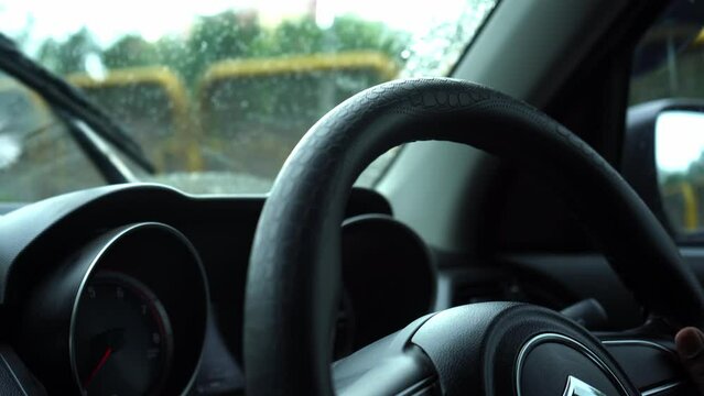 close up of person driving car. rash driving, bumpy ride 