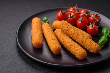 Delicious crispy cheese sticks with mozzarella, salt and spices, breaded and fried in oil