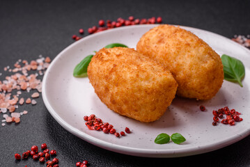 Delicious baked potato cutlet stuffed with chicken and vegetables, spices and salt