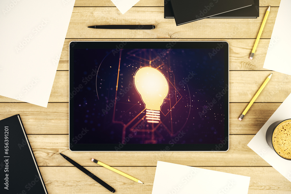 Poster Creative light bulb hologram on modern digital tablet screen, idea concept. Top view. 3D Rendering