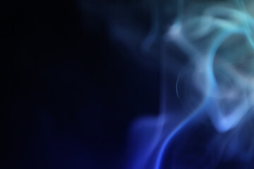 Blue smoke on a dark background, fog pattern, detailed smoke shapes	
