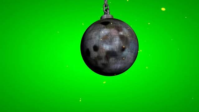 Metallic wrecking ball. Wrecking ball swinging in the foreground Chroma key. On green screen