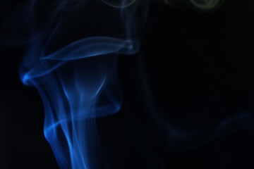 Blue smoke on a dark background, fog pattern, detailed smoke shapes