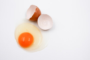 Broken egg isolated on white background.
