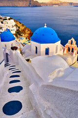 Famous Santorini, Greece, white village and churches on sunny day