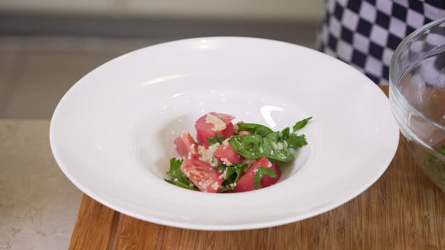 Serving fresh vegetable salad with cuscus