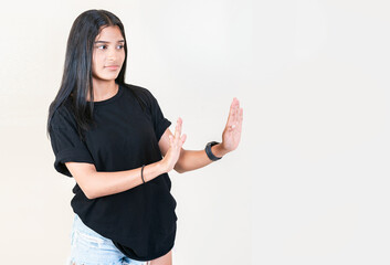 Displeased girl rejecting with palms hands isolated. Intense displeased young girl with rejection...