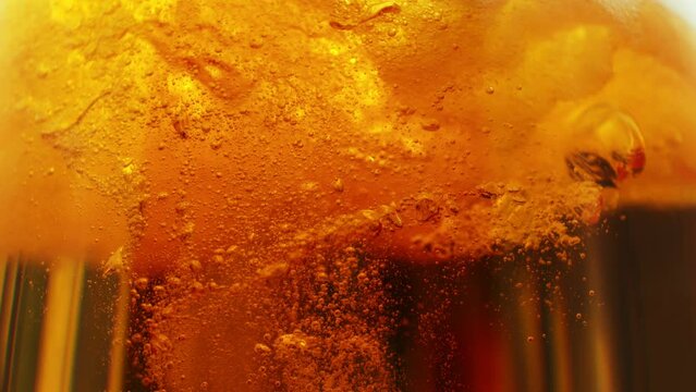 Super Slow Motion Shot of Rising Beer Bubbles and Fresh Foam Background at 1000fps.