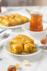 Pistachio baklava. Close-up baklava isolated on white background. Mediterranean cuisine delicacies