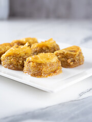 Pistachio baklava. Close-up baklava isolated on white background. Mediterranean cuisine delicacies