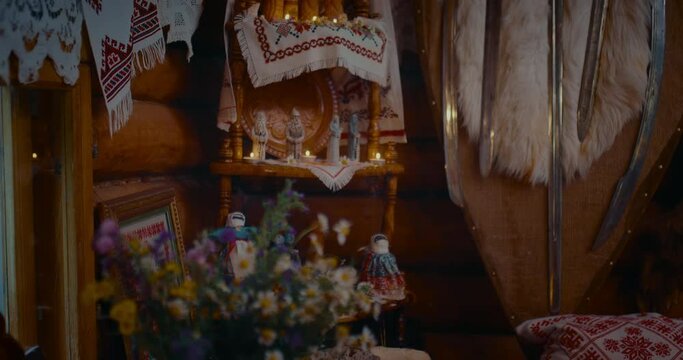 interior of ancients Slavic house, altar with pagan idols, amulets and candles in house, 4K, Prores