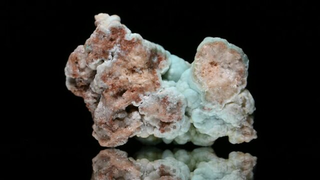 Green Hemimorphite or Calamine sample rotating slowly against a black background.