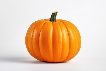 A Large Orange Pumpkin Sitting On Top Of A White Table