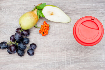 still life of organic fresh fruits and vegetables, one red lid on wooden surface. Concept of healthy diet food. Place for logo or text