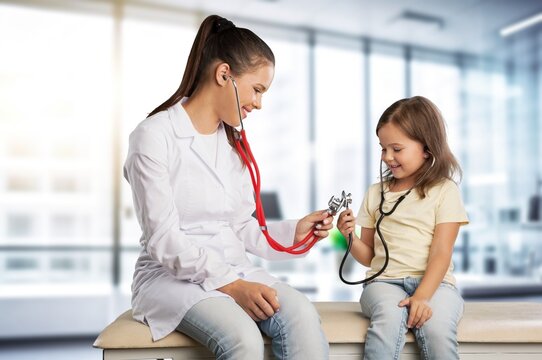 Pediatrician doctor examining cute child in clinic, AI generated image