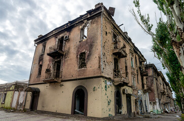 destroyed and burned houses in the city during the war in Ukraine