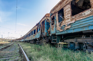Fototapeta na wymiar burned out blown up wagons war between Russia and Ukraine