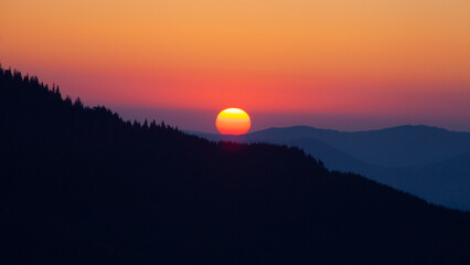 Sunrise sky over the Dragobrat in Carpathian mountains, Ukraine
